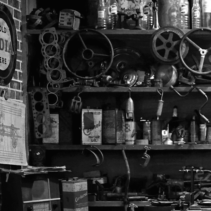 Vintage Automobile in Workshop - Black and White Poster